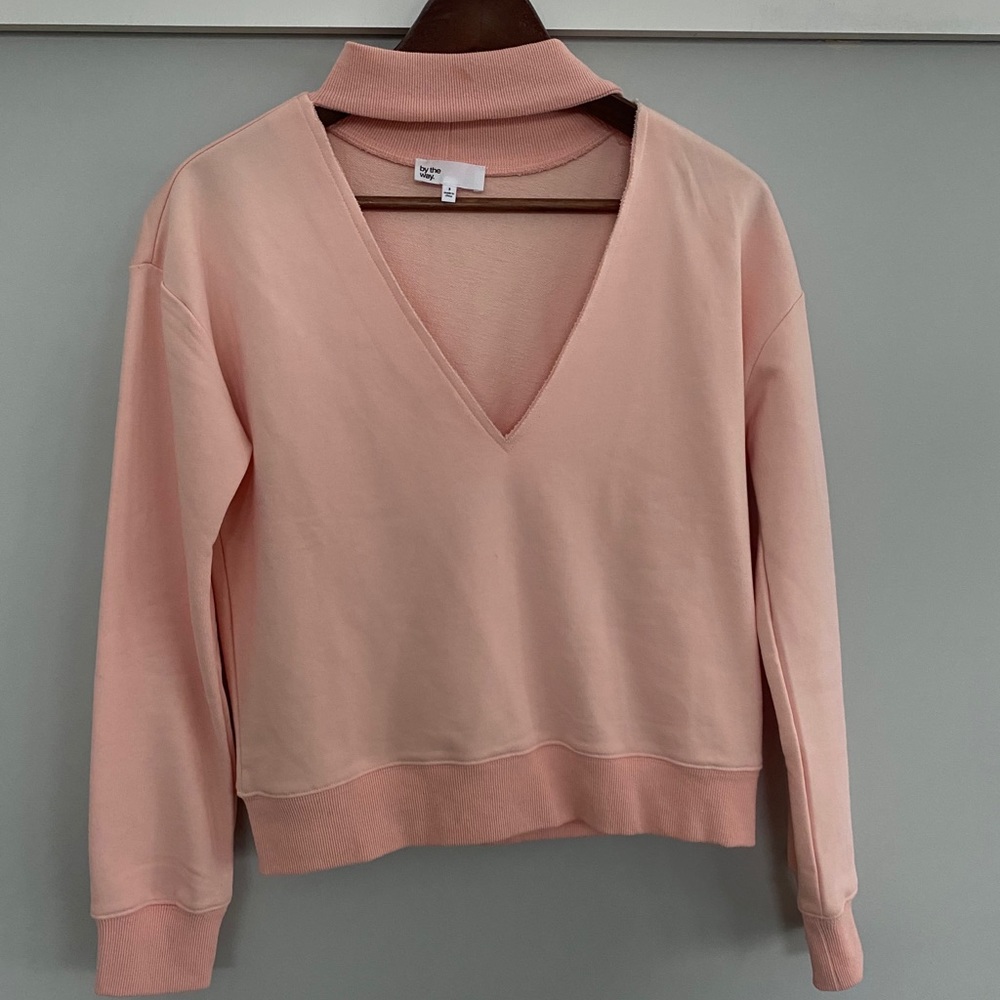 by the way. Pink V neck sweatshirt
